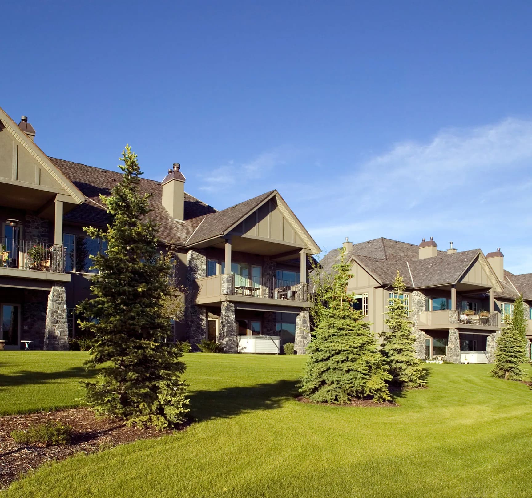 A terrace of contemporary residential properties on landscaped grounds